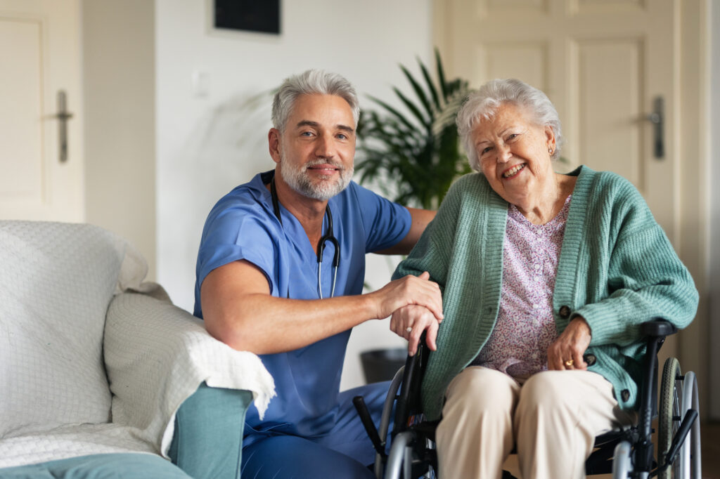 Caregiver doing regular check-up of senior woman in her home.